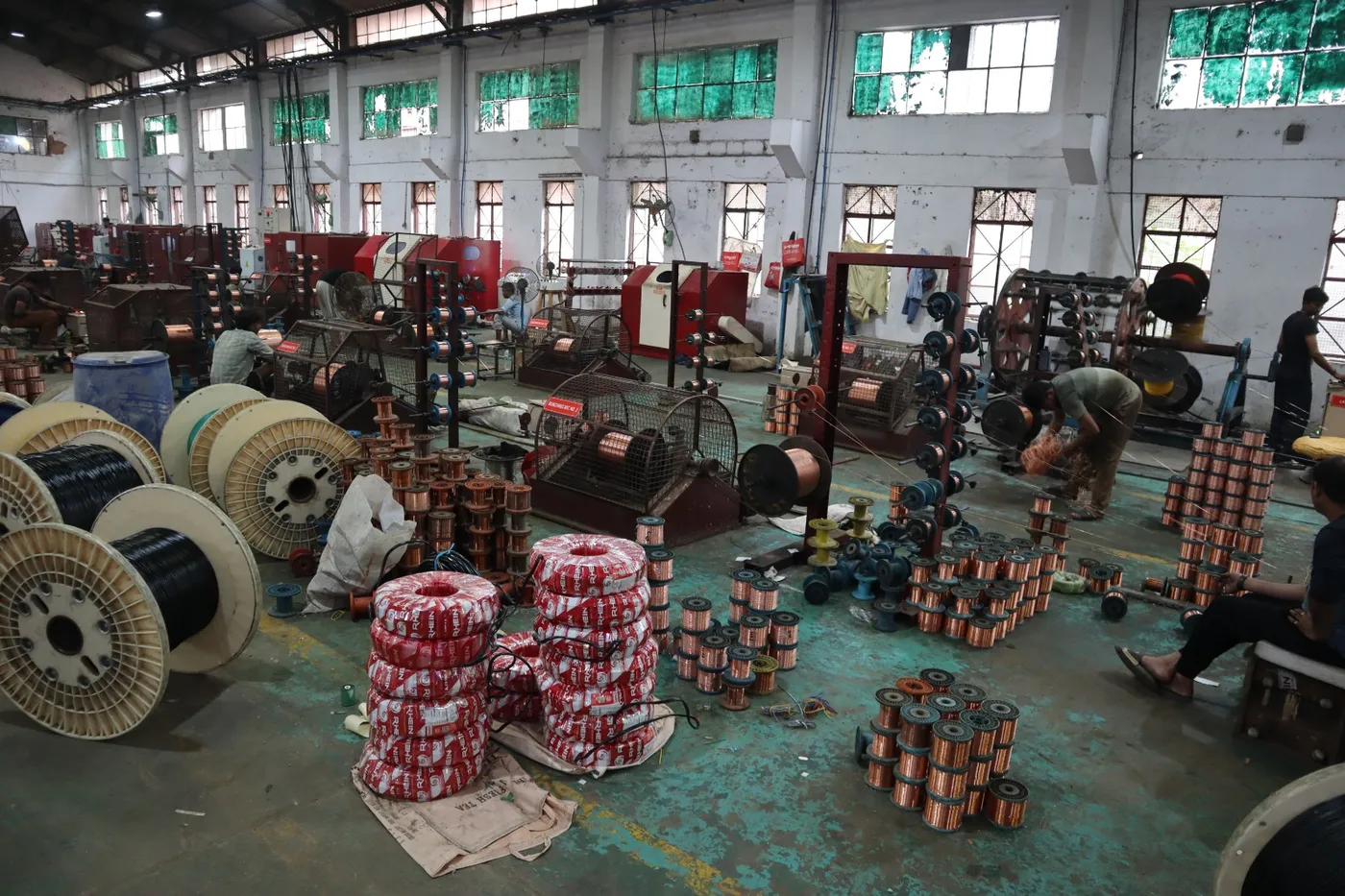 Bare copper wire spools on the drawing floor