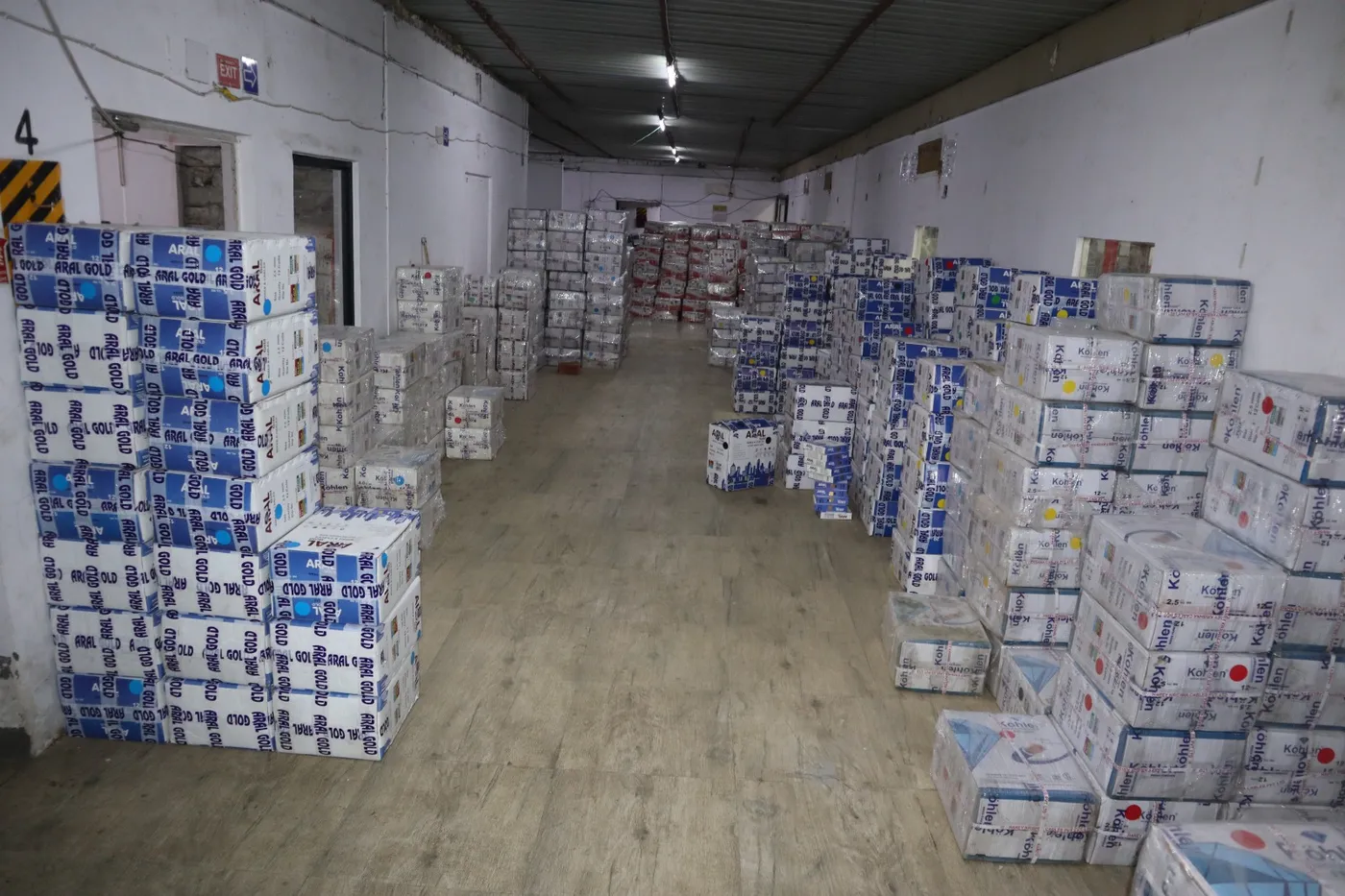 Rhein cartons staged in the dispatch area beside the warehouse office